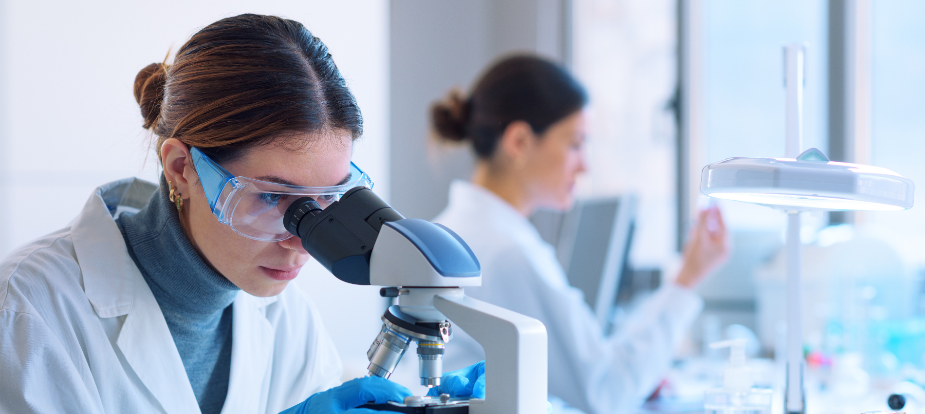 Female Researcher Microscope